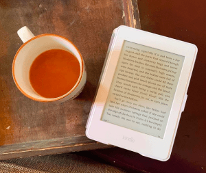How to stop emotional eating: Mug of tea and Kindle e-reader on end table